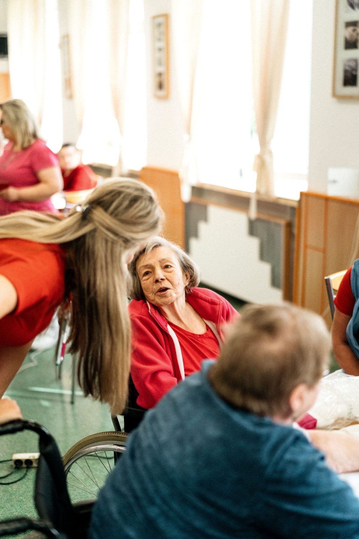 A care team spending time with a resident in a care home